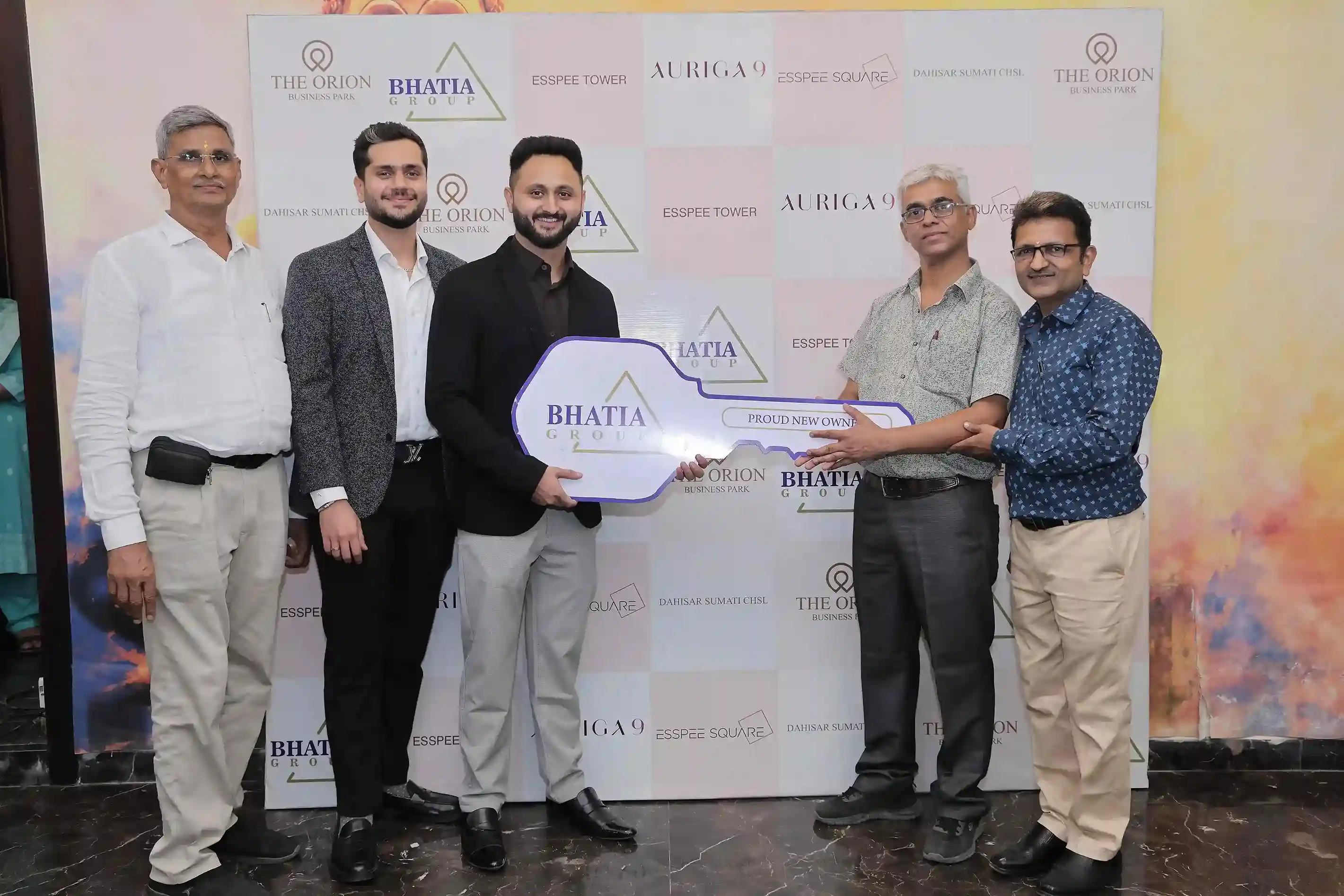 Happy Homebuyer Receiving New House Keys by Bhatia Builders